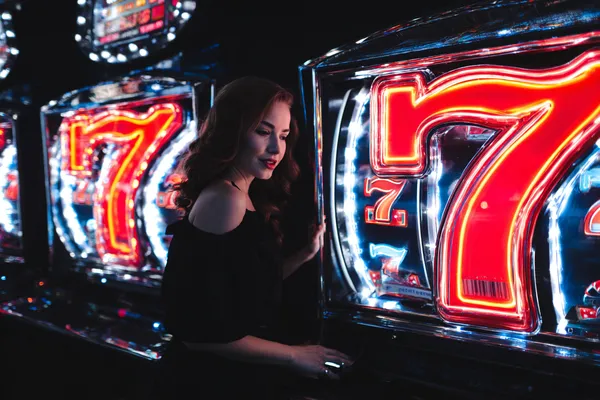 A stylish woman beside vibrant slot machines displaying glowing sevens, showcasing the variety of top slots at 10WIN.